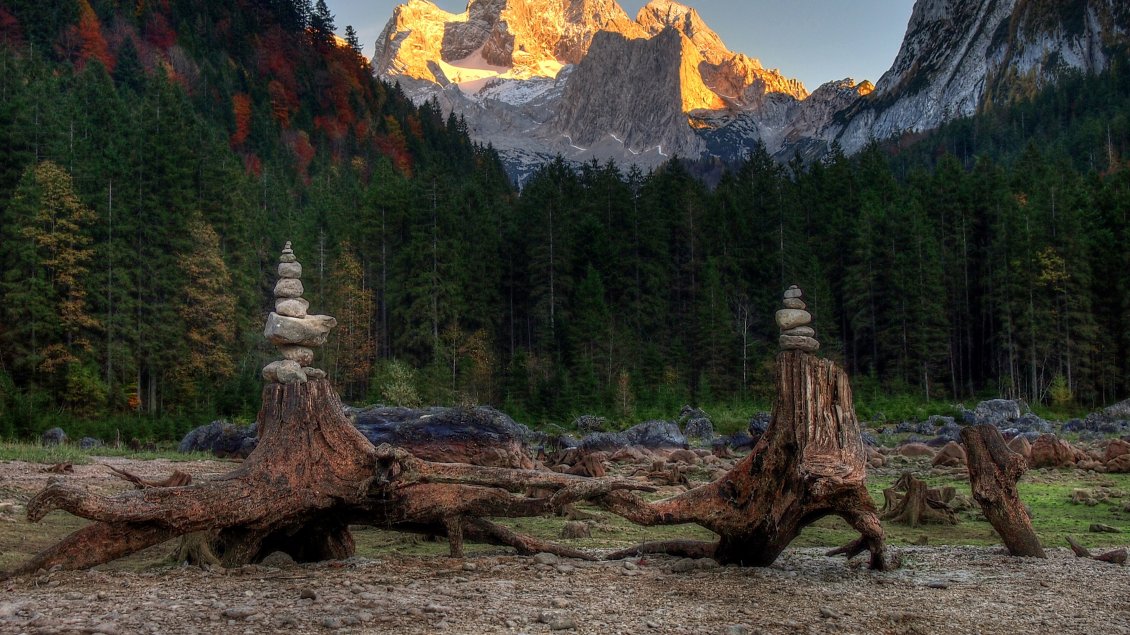 Download Wallpaper Towers made of tree trunks and stones