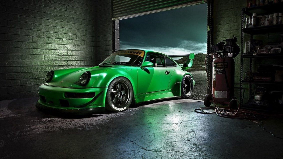 Download Wallpaper Green Porsche Carrera in a garage - Sports car