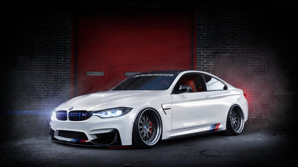 Download Wallpaper A beautiful white BMW F82 M4 in a garage