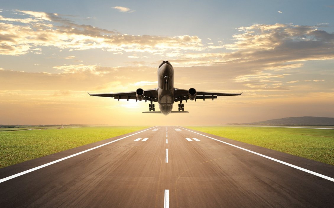 Download Wallpaper Plane lands on the runway on sunrise