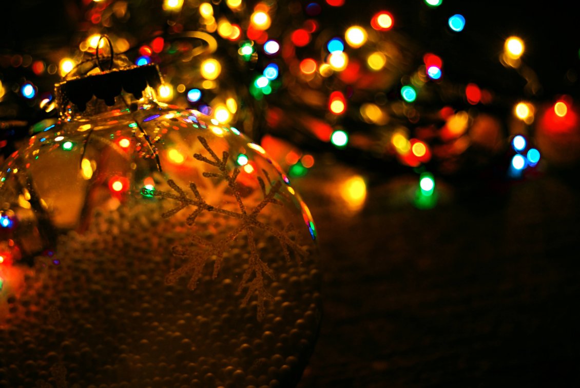 Download Wallpaper Big snowflake on a Christmas ball - Lights on background