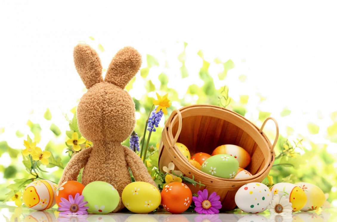Download Wallpaper Funny rabbit and a basket with coloured Easter eggs