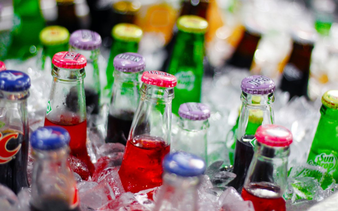 Download Wallpaper Bottles of soda in the ice - Fresh drink in a summer hot day