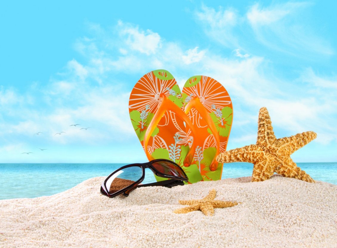 Download Wallpaper Flip flop and sunglasses on the beautiful golden beach sand