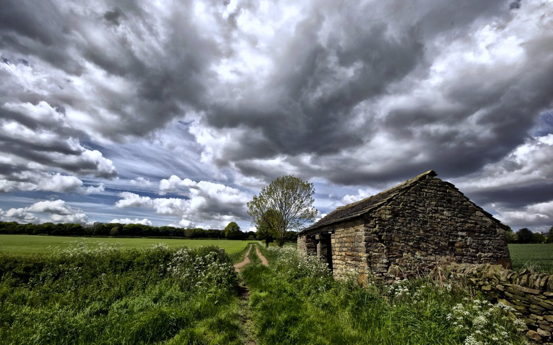 Download Wallpaper Old rock house cottage and country road near green field