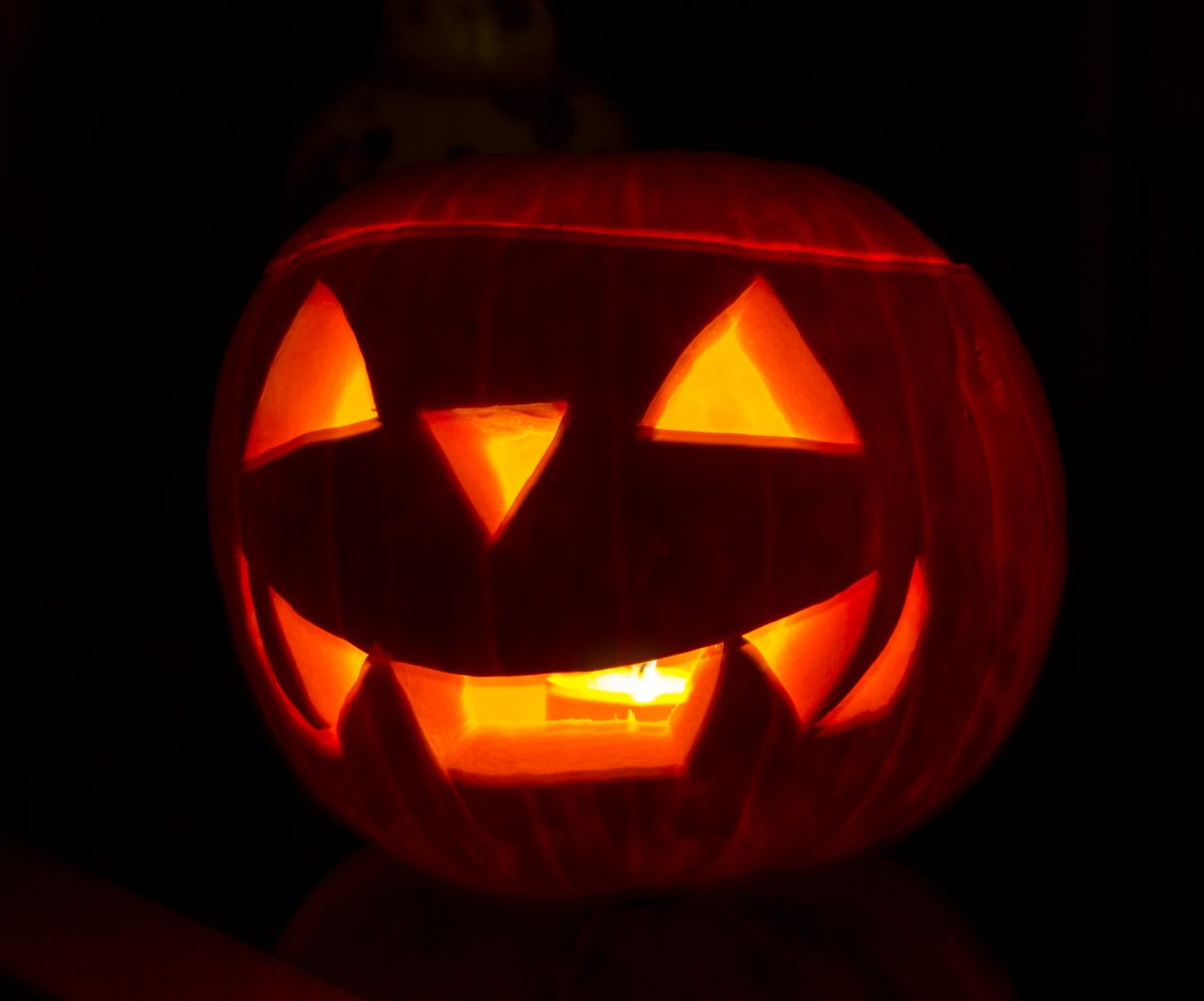 Download Wallpaper Scary pumpkin with candle inside for Halloween night