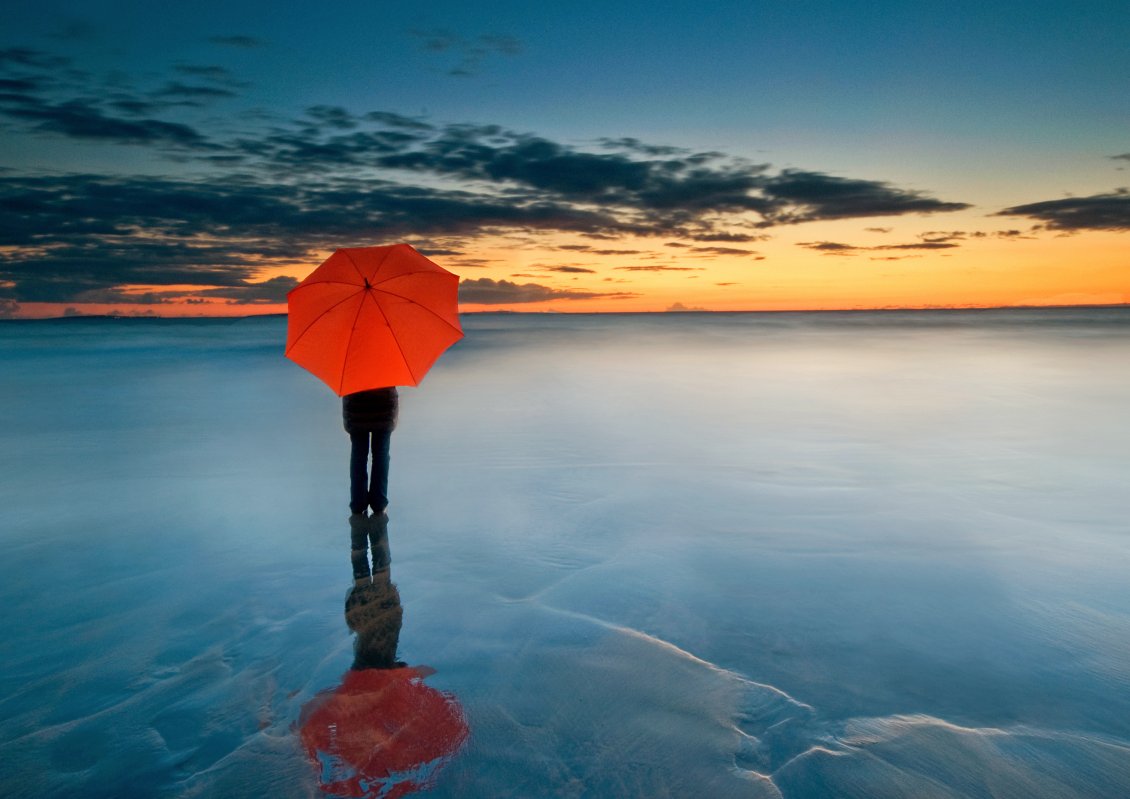 Download Wallpaper Abstract photo - Man with orange umbrella on a frozen water