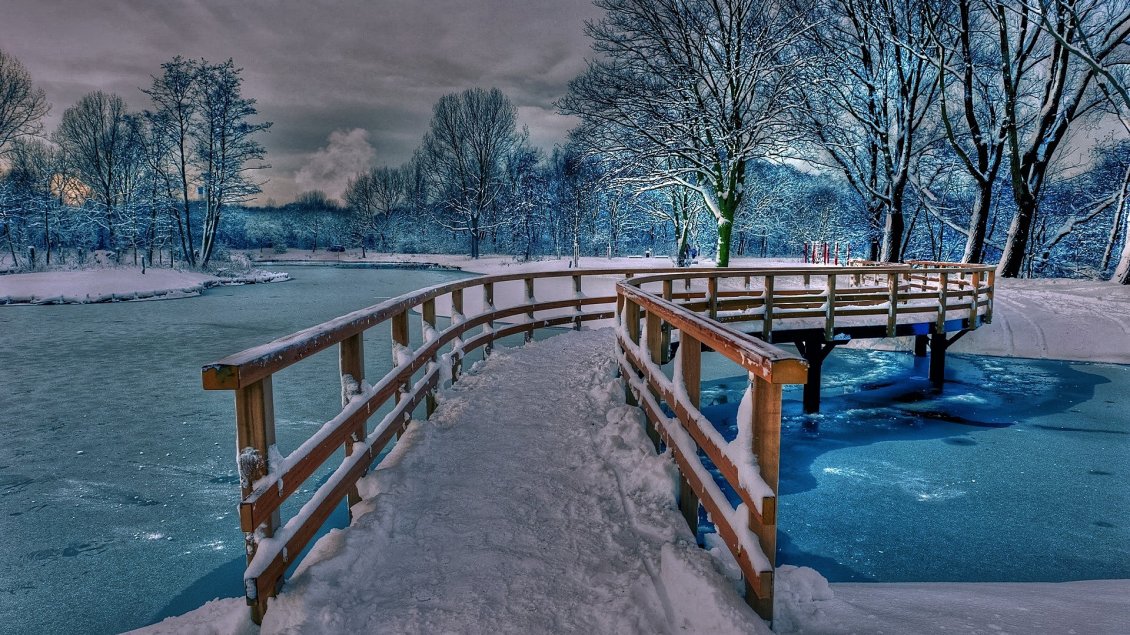 Download Wallpaper Wonderful frozen bridge over a frozen lake with blue water