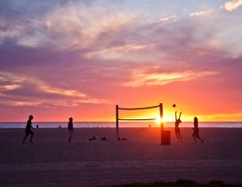 Volleyball on beach, sunset