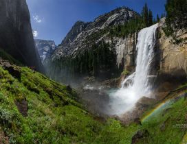 National Park - waterfall, montains, cliffs and rainbow