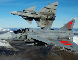 Two Military Saab Viggen 37 in the sky