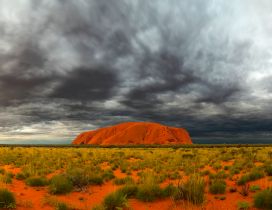 Ayers Rock and sky with clouds in Australia