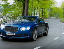 Cruising blue Bentley Continental GT Speed