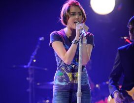 Miley Cyrus singing live in at a concert