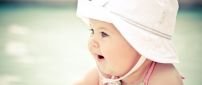 Cute baby girl with white hat