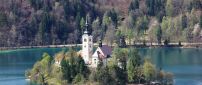 Island between montains in lake Bled in Slovenia