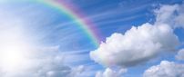 Rainbow over the blue sky