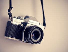 Classic photo-camera on the wall - abstract wallpaper