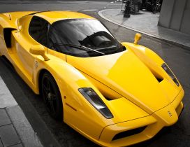 Yellow Ferrari Enzo on the street