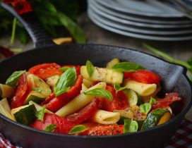 Pasta with vegetables and mint in pan
