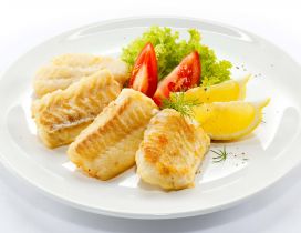 Cooking fish with vegetables and lemon