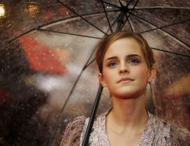 Emma Watson with umbrella in the rain