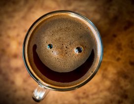 Smiley face in coffee cup
