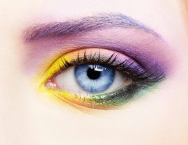Girl with colorful makeup and blue eyes