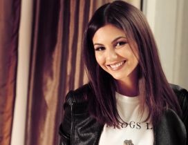 Victoria Justice with a smile on her face