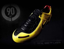 Yellow and black nike boots