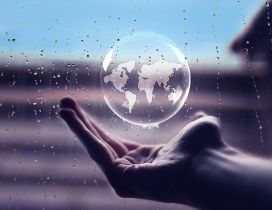 Rain bubble in hand with the earth map - Artistic wallpaper
