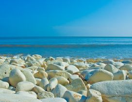 White big stones on the shore of the sea