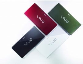 Four Sony Vaio laptops in different colors