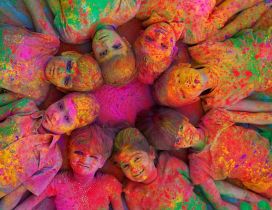 Children in many colors enjoying holi colors