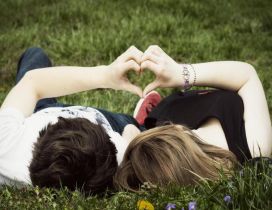 A couple on the grass - Romantic moment