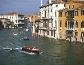 Buildings of Venice, Italy and speed boats on water