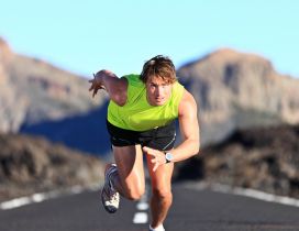 An athlete runnig speed on the road