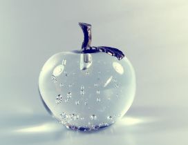 Transparent apple made of glass and metal