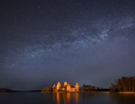 Trakai island, castle and lake under the stars