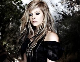 Avril Lavigne in black in the forest