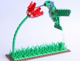 A green bird on the flower - Art made of lego