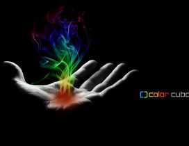 Smoke in many colors on a hand