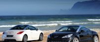 Two Peugeot RCZ on the beach