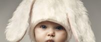 Cute child with white hat with bunny ears