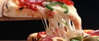 Hot cheese stretches slice of pizza