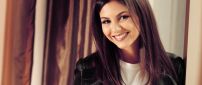 Victoria Justice with a smile on her face