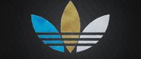 Adidas logo in three colors: white, blue and brown