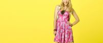 Bridgit Mendler in pink dress on the yellow background