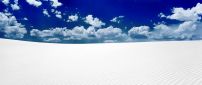 White sand in desert and blue sky