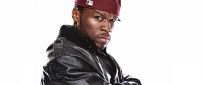 50 Cent with red cap and black jacket